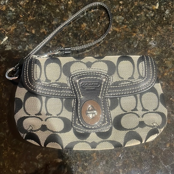 Coach Handbags - Coach Wristlet approximately 7.5 inches long by 5 inches wide. Good condition.